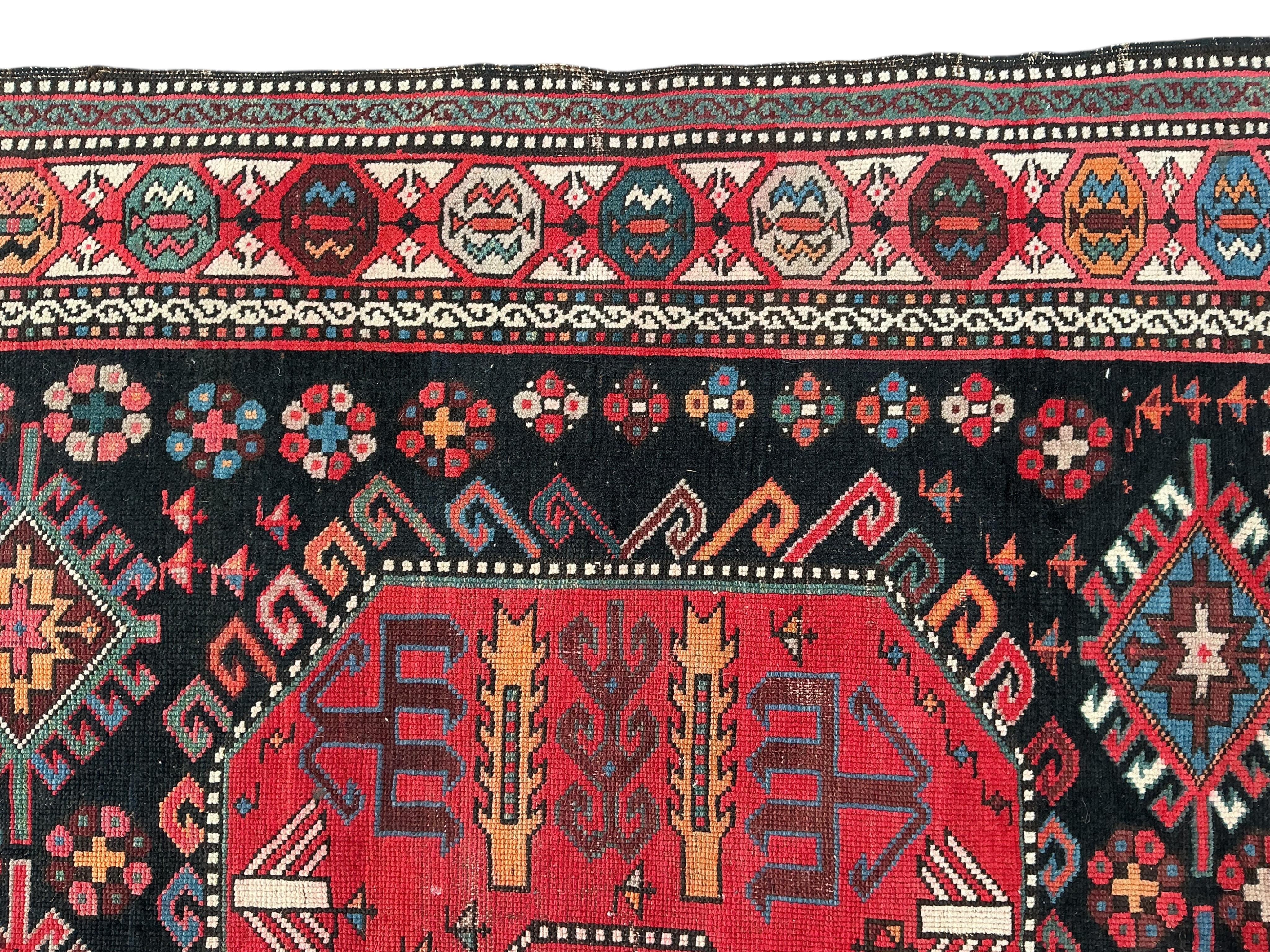 An antique Caucasian blue ground rug, 280 x 140cm